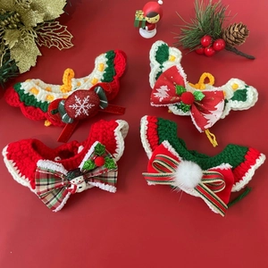 Detailed view of hand-knitted Christmas pet collars featuring reindeer and snowman patterns
