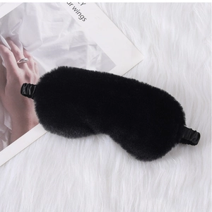 Detail of a black faux fur sleep mask featuring a smooth satin elastic head strap
