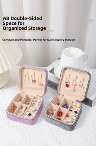 Macro detail of portable velvet jewelry box with zipper and interior compartments