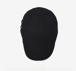 Top down view of black ivy flat cap featuring fine textured knit fabric and neat stitching