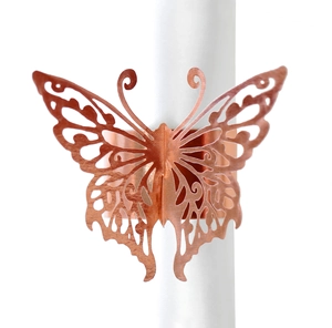 Detail view of a rose gold butterfly napkin ring featuring laser-cut metal hollow design