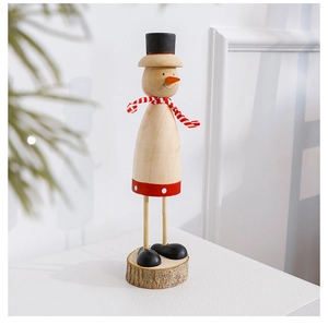 Detail of wooden snowman decor with red scarf and top hat on a natural wood base
