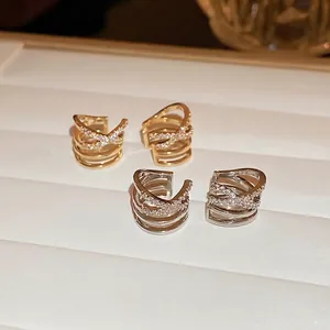 Cross-layered gold and silver ear cuffs with sparkling zircon stones for women