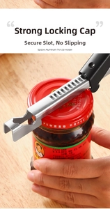 Close-up of stainless steel multi-function opener prying open a jar lid on wooden desk