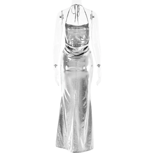 Detail of silver metallic evening dress featuring crisscross back straps and mermaid hem