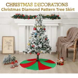 Detail of red and green knit Christmas tree skirt with decorative white pom pom fringe