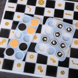 Macro detail of crown pattern silicone molds for resin crafts on a checkered board