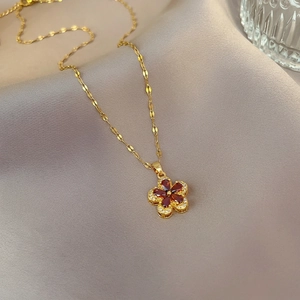Elegant gold titanium steel necklace with garnet red five-petal flower and crystal inlay