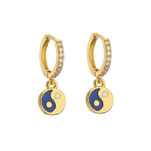 Detail of gold huggie earrings with zircon pavé and blue white yin yang enamel charms