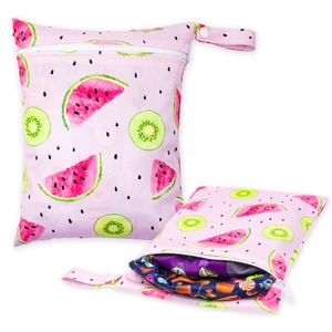 Detail of pink waterproof baby diaper bag with fruit prints and double zipper pockets