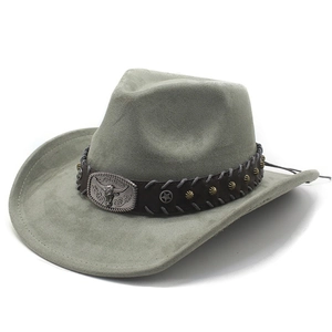 Macro shot of grey suede cowboy hat featuring a metal bull head buckle and star studs