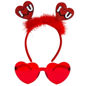 Detail view of Valentine party set with red feather heart headband and heart sunglasses