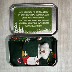 Christmas teddy bear plush doll in decorative metal box with festive greeting card