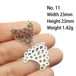 Macro detail of fan-shaped hollow connector in silver and gold for DIY jewelry making