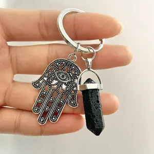 Natural crystal hexagonal pillar keychain with Hamsa hand and evil eye charm