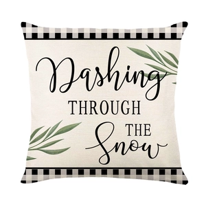 Christmas cushion cover featuring Dashing Through The Snow text and buffalo plaid trim