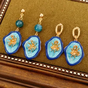 Vintage oval floral earrings and pendant with blue enamel and golden metal core