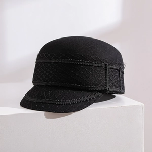 Elegant black wool newsboy cap featuring a delicate net veil overlay for women