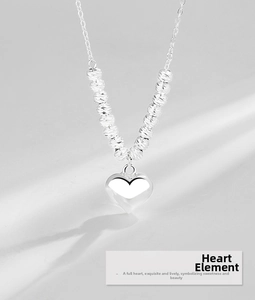 Detailed macro view of S925 sterling silver heart pendant with engraved texture beads