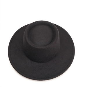 Top view of a black flat-top wool felt pork pie hat with a wide stiff brim design