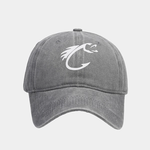 Close-up of grey washed canvas baseball cap featuring white embroidered fish logo detail