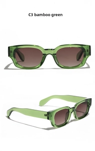 Detailed close-up of bamboo green cat-eye sunglasses with gradient lenses