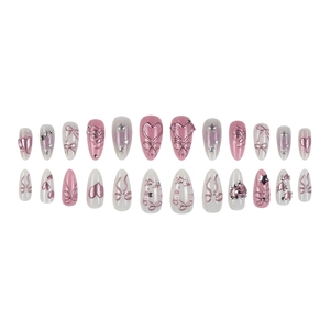 Set of 24 3D pink press-on nails with metal hearts, bows and pearls in a grid layout