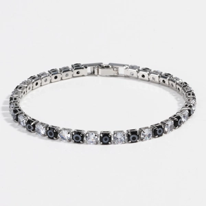 Close-up of 4mm tennis bracelet with clear zircons and black evil eye square charms