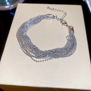 Detail of silver multi-layer beaded chain bracelet with adjustable lobster clasp closure