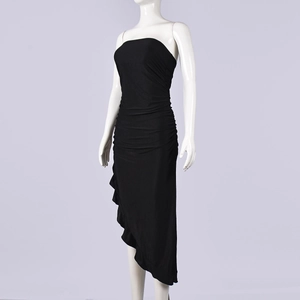 Detail of ruffled hem and side ruched texture on a black bodycon off-shoulder dress