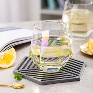 Geometric hexagonal iridescent glass cup with colorful finish for whiskey or juice