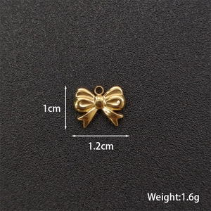 Polished gold bow pendant charm for DIY jewelry with 1.2cm width dimensions and weight