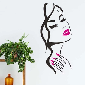 Detail of red lips wall sticker with female profile on white living room wall