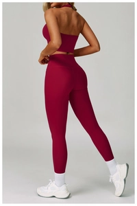 Rear view of burgundy yoga set featuring high-waist leggings and a backless crop top