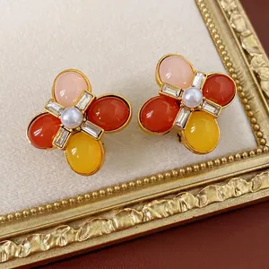 Vintage gold floral earrings with colorful gemstones and white pearls in French retro style