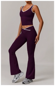 Detail of high-waisted flared yoga pants with white cross-waist trim and purple fabric