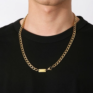 7mm gold Cuban link necklace with rectangular pendant for men on a black shirt