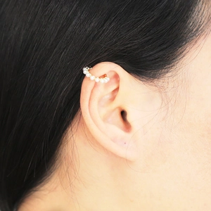 Elegant 18k gold plated C-shaped ear cuff with white pearls for women on model ear
