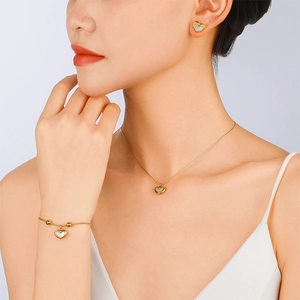Elegant gold heart jewelry set with white shell inlay for women including necklace and bracelet