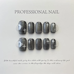 Handmade rainbow cat-eye press-on nails with white planet and star designs