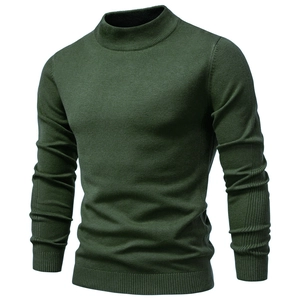 Detailed knit texture of a slim-fit dark green turtleneck sweater with ribbed cuffs