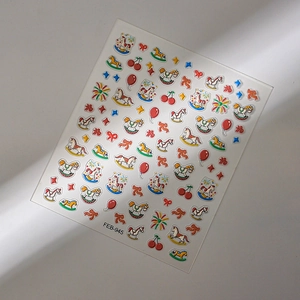 3D embossed nail stickers featuring rocking horses, red balloons, and festive motifs