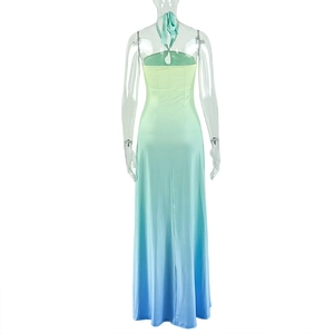 Detail of gradient halter maxi dress with backless design and flowy A-line silhouette