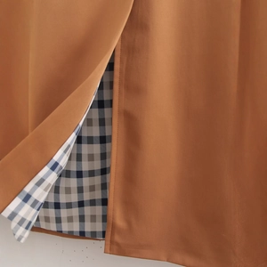 Women's long brown coat with stylish blue plaid lining detail and high density woven fabric