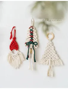 Detail of handmade macrame Christmas ornaments including Santa and braided trees