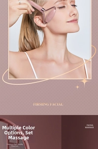 Close-up of rose quartz facial roller with golden metal frame for firming massage