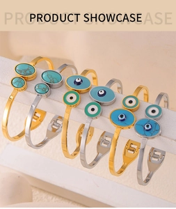 Bohemian titanium steel bracelets with evil eye motifs and turquoise inlay on display