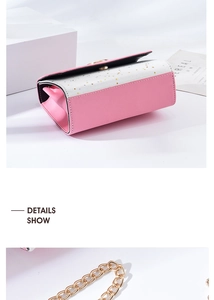 Detail show of pink and silver square crossbody bag with gold star and chain strap