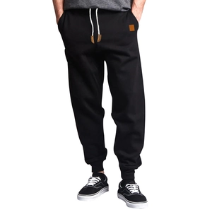 Close-up of black joggers showing drawstring waist and heavy-weight cotton fabric texture