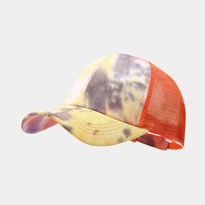 Detail of colorful tie-dye baseball cap featuring orange breathable mesh and adjustable strap